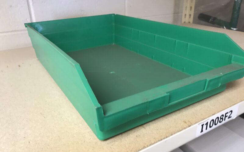 green plastic shelf bins